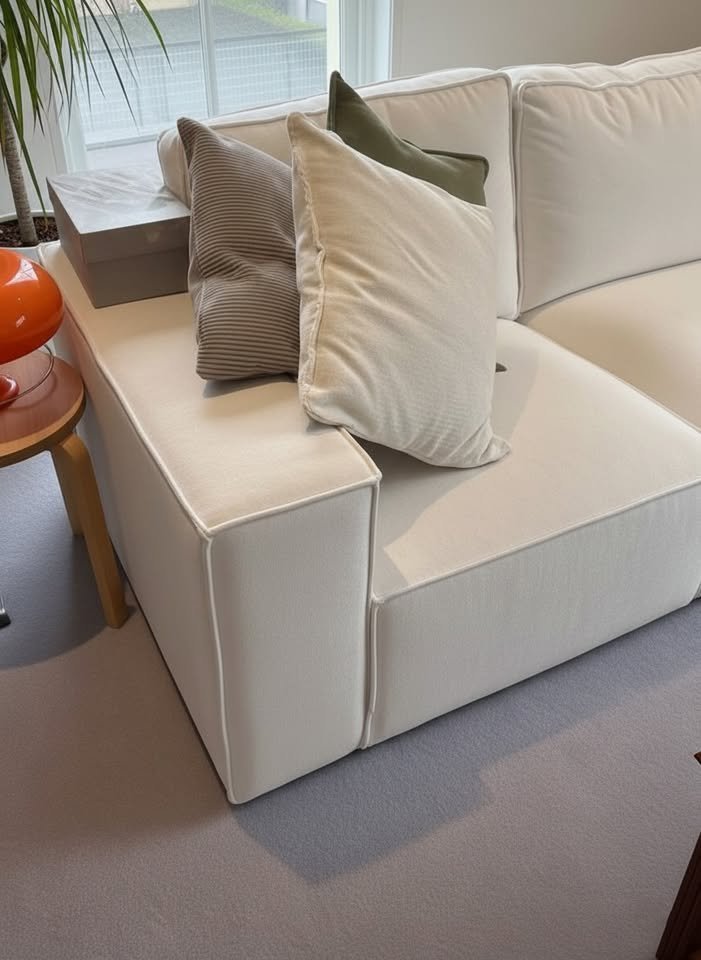 White L-Shaped Sofa with Footstool and Throw Pillows606182571886530563